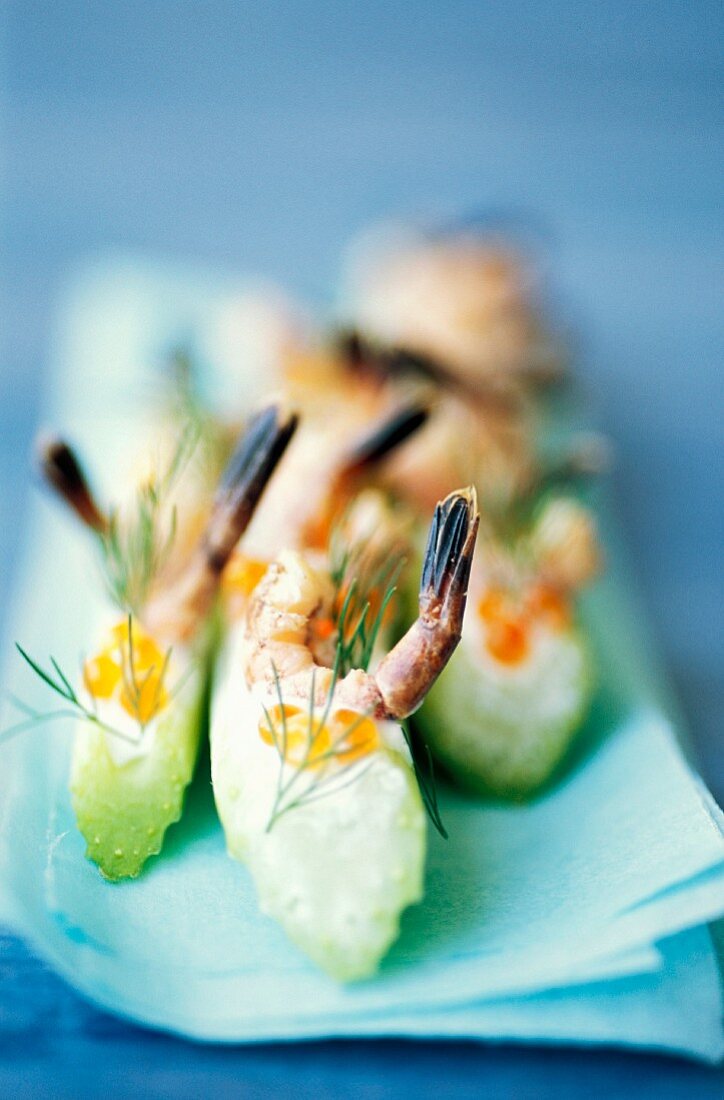 Celery sticks with trout caviar and shrimps