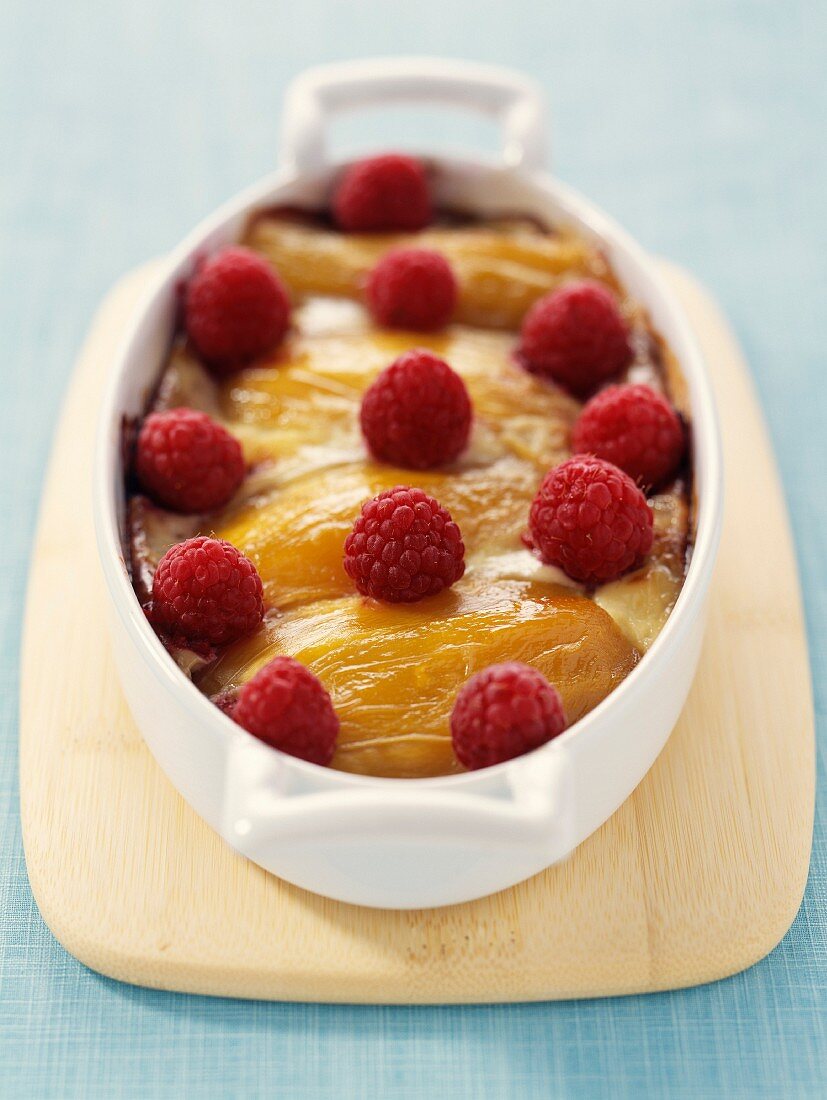 Mango gratin with fresh raspberries