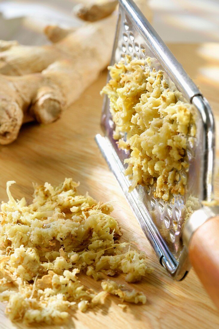 Grated ginger and a grater