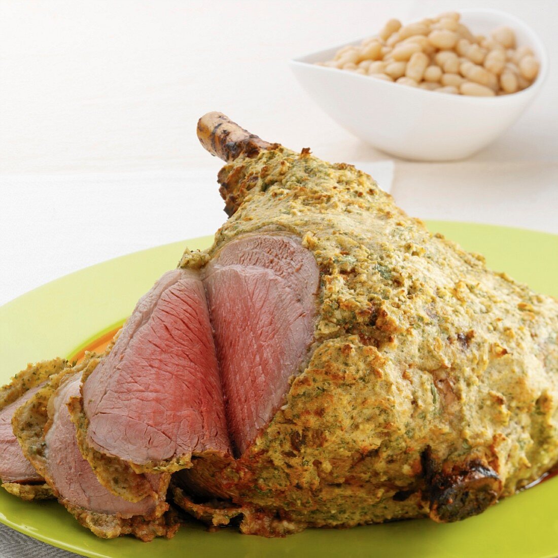 Leg of lamb with a mustard crust and white beans