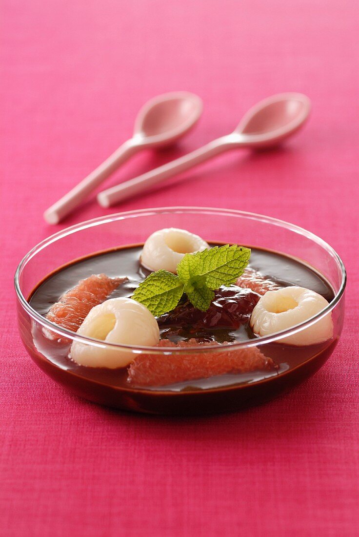 Hot chocolate soup with lychees, grapefruit and rose jam