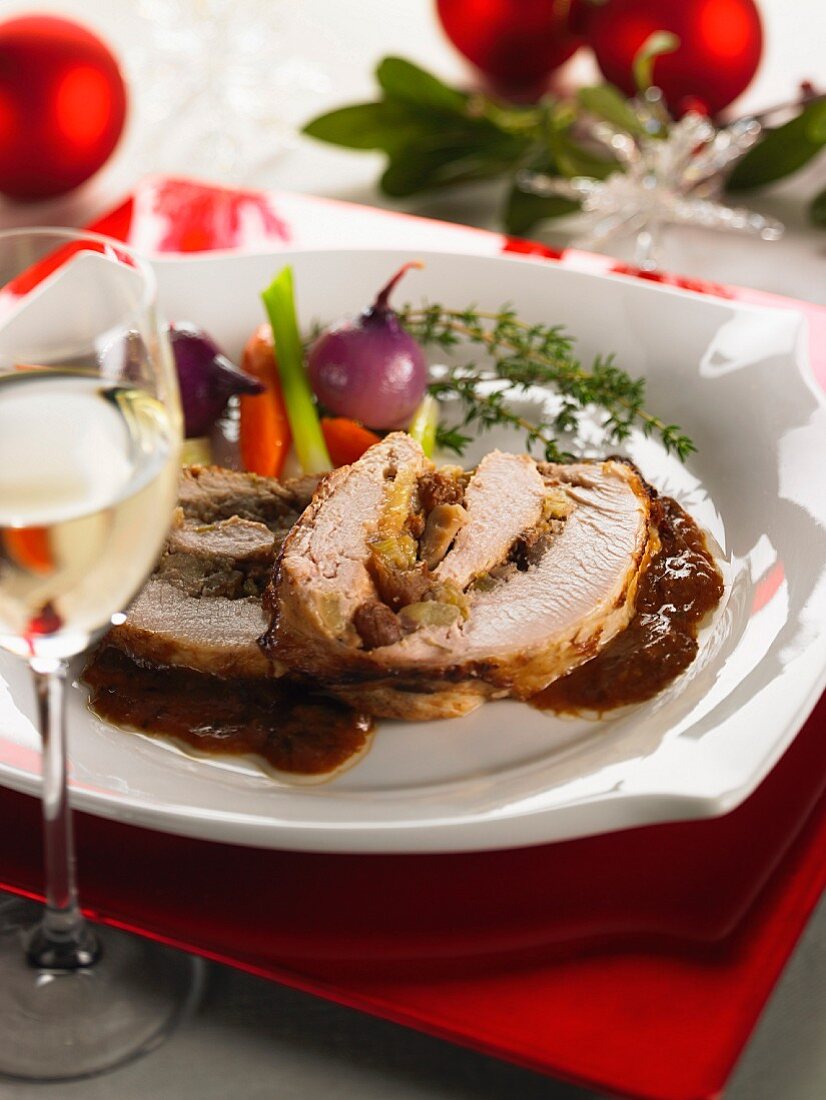 Stuffed roast pork with chestnuts and raisins