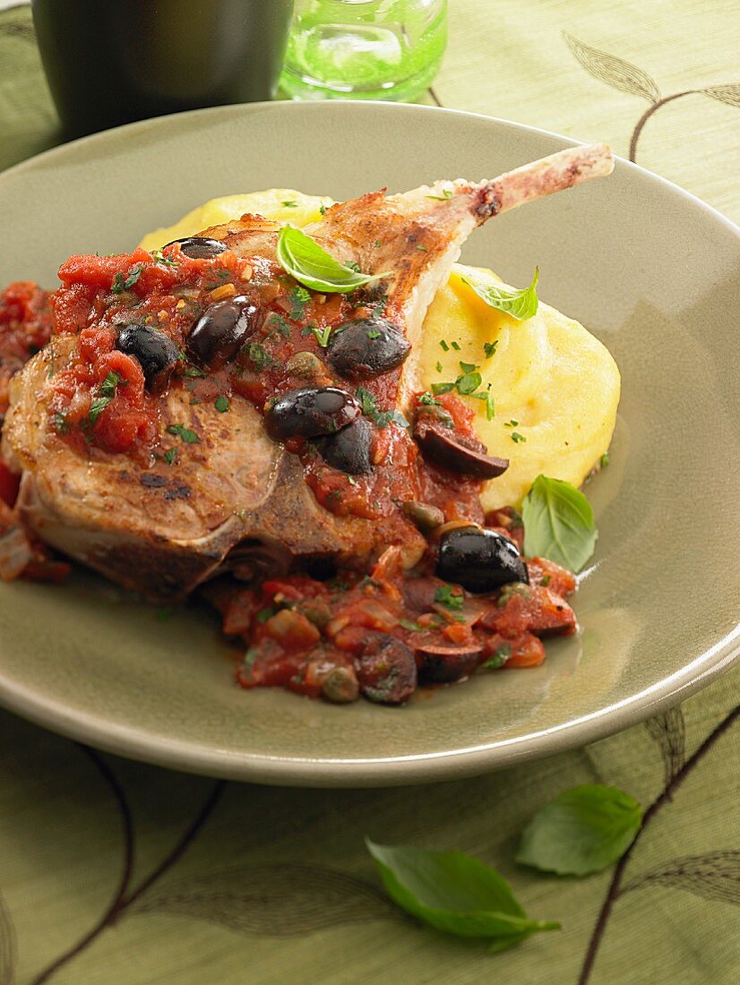 Lamb chop with tomato sauce and olives