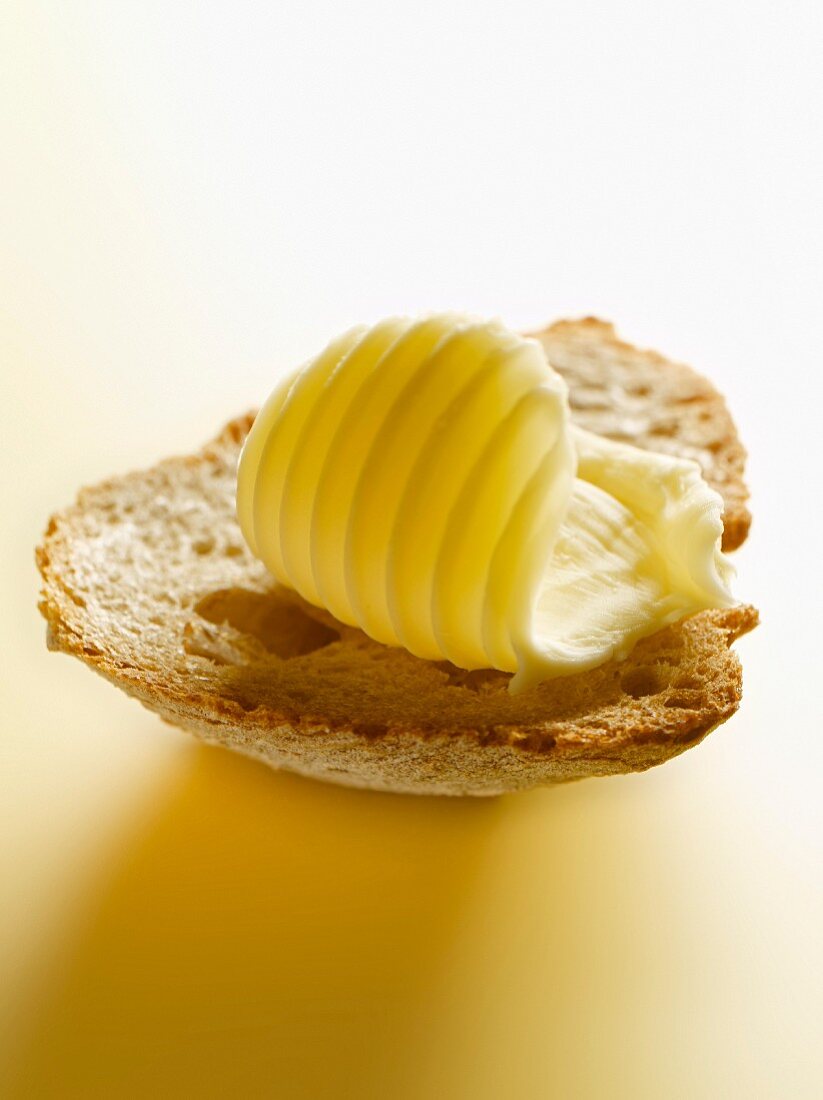 Butter on a piece of bread