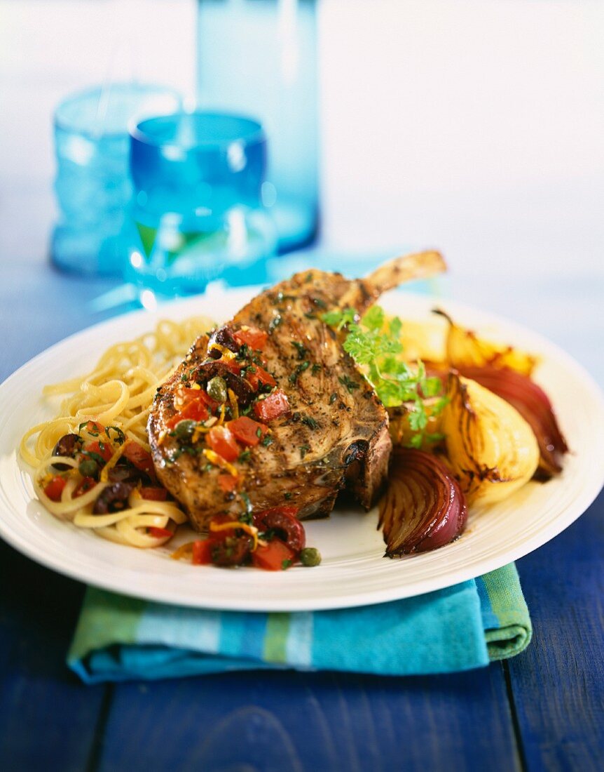 Grilled lamb chop with onions and linguine