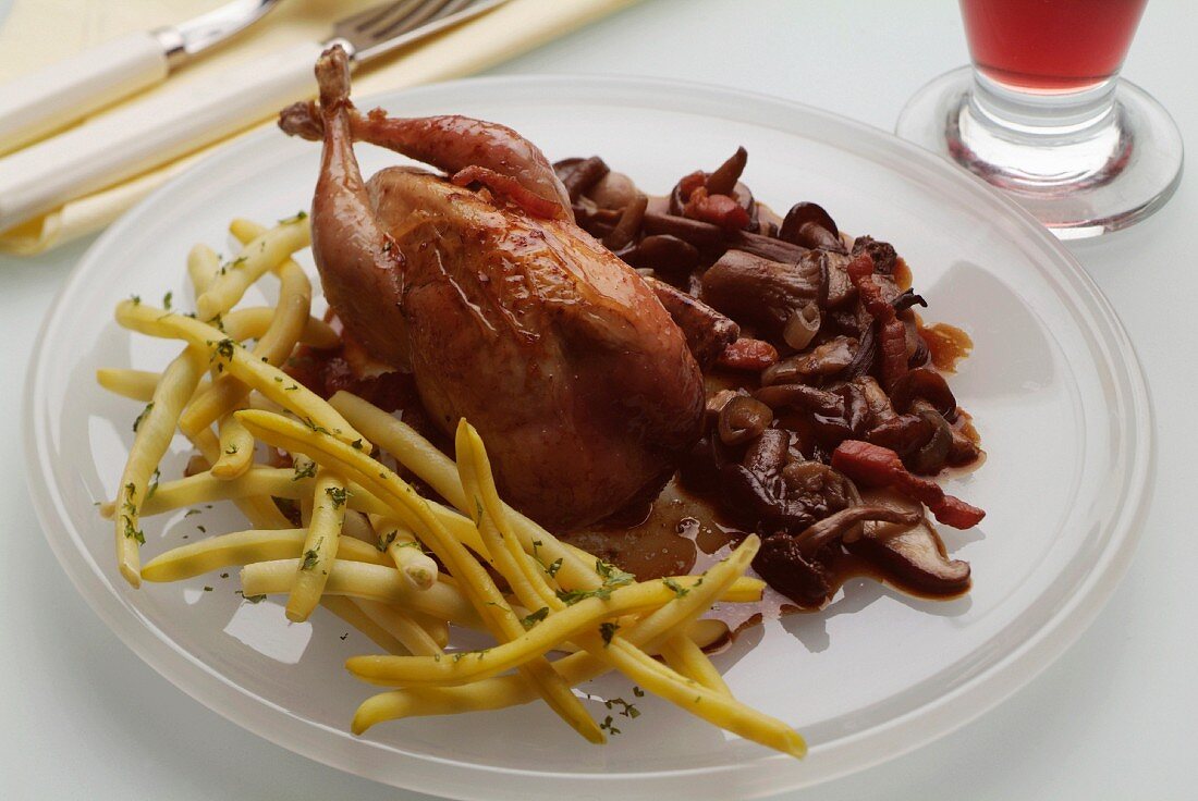 Quail with butter beans and mushrooms