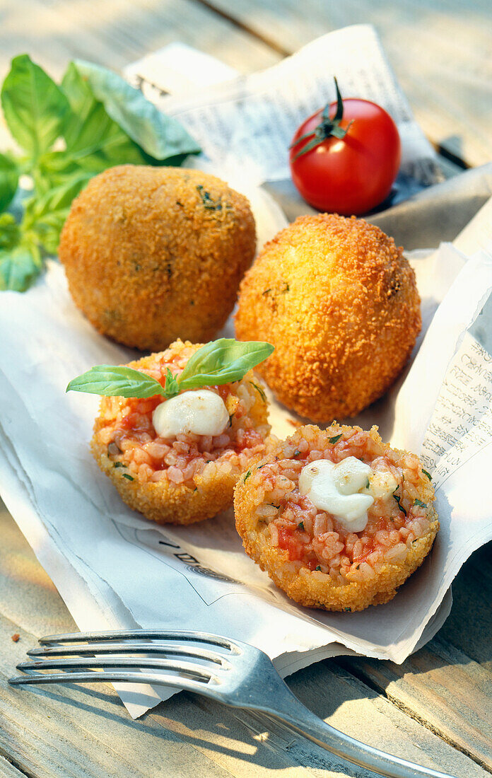 Breaded risotto balls with tomato,basil and mozzarella