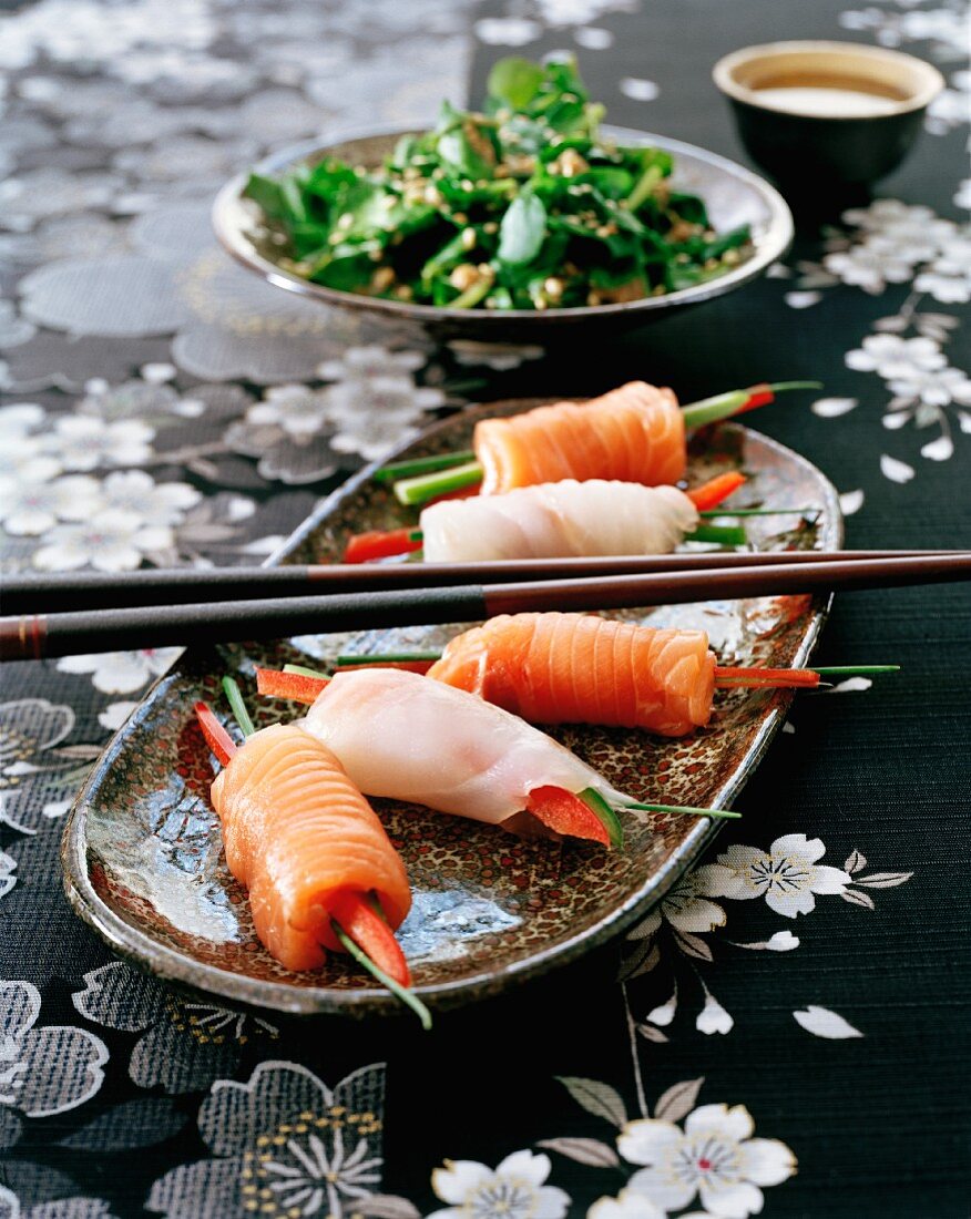 Sashimi rolls made from salmon and branzini with julienned vegetables