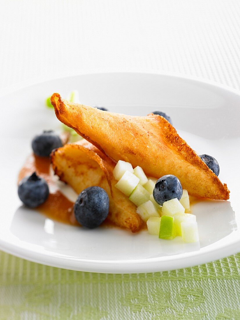 Brick dough pastries with apples and blueberries