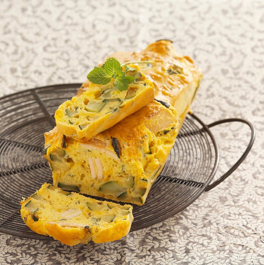 Savoury loaf cake with chicken, courgette and mimolette cheese