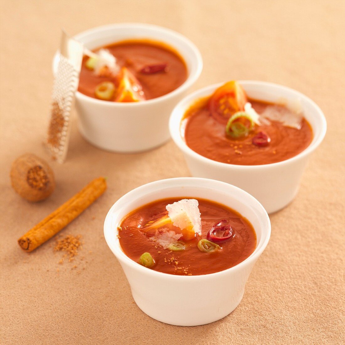 Tomato soup with spices and Parmesan shavings