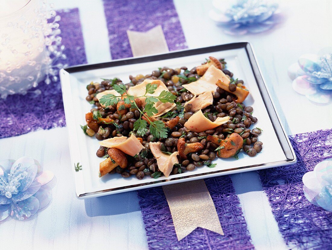 Warm lentil salad with truffle oil and strips of foie gras