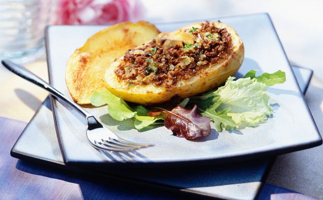 A baked potato with a mushroom filling