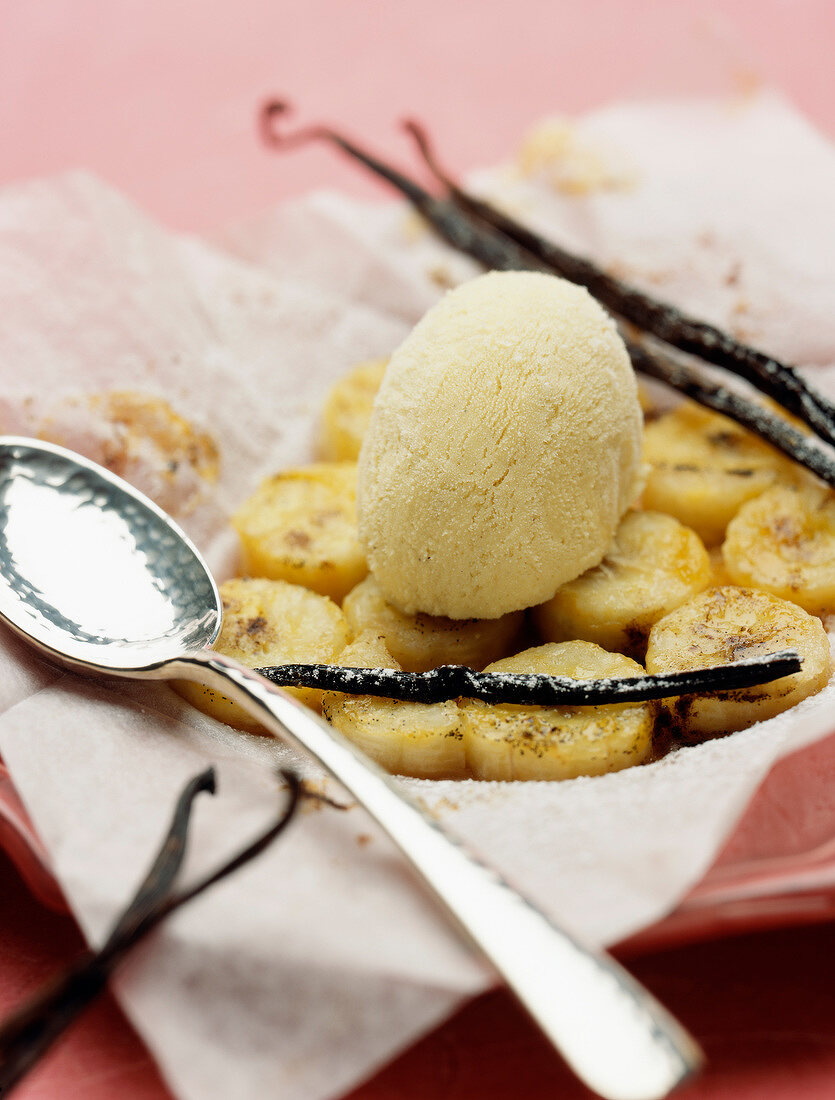 Vanilla-flavored bananas cooked in wax paper and served with a scoop of ice cream