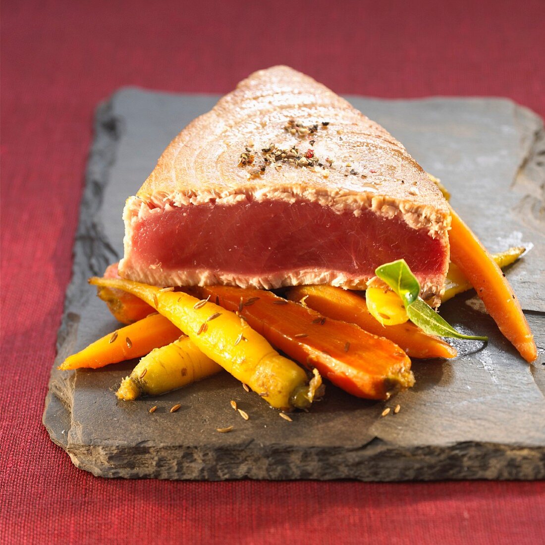 Grilled tuna and a carrot medley with caraway