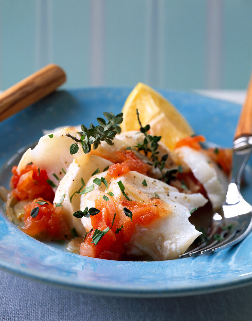 Shredded cod with tomatoes