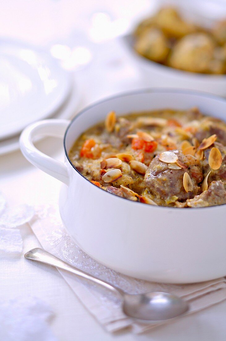 Beef stew with coconut milk and sliced almonds