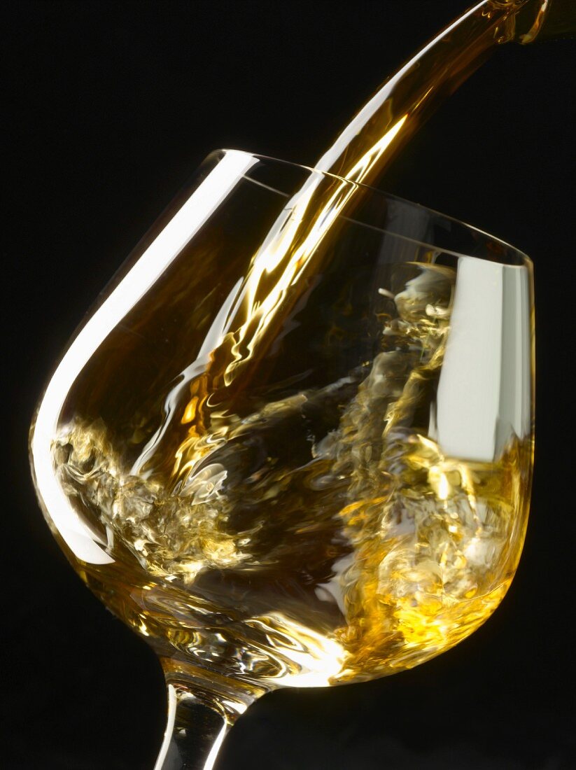 Pouring a glass of white wine