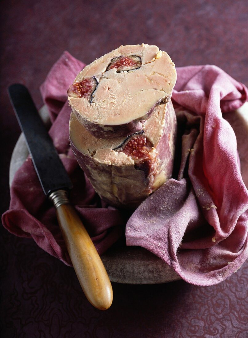 Cloth-wrapped foie gras with figs poached in red wine