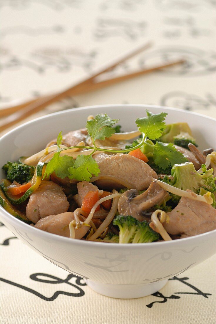 Chicken and vegetables cooked in a wok