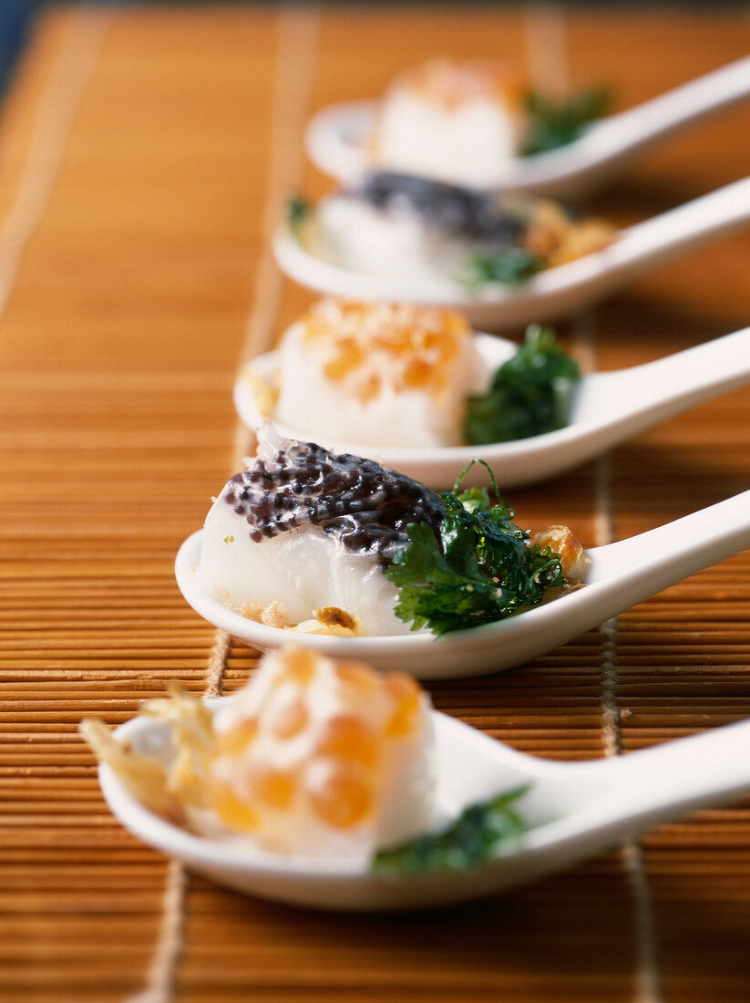 Bite-size rice cakes with salmon roe and caviar
