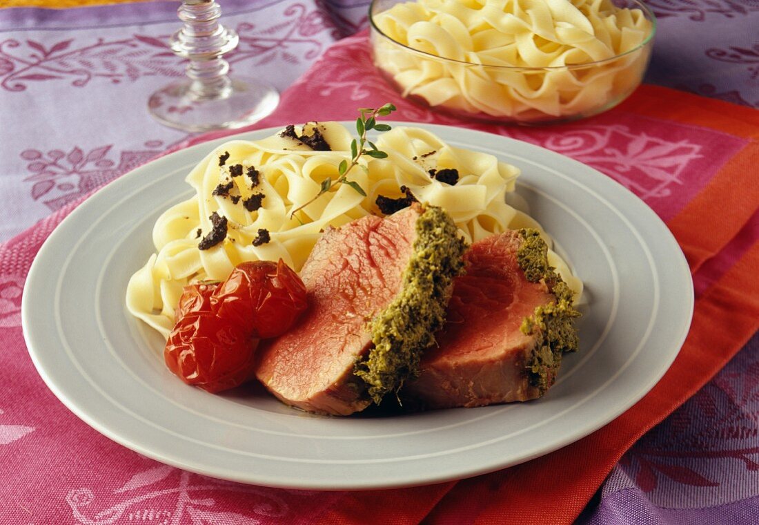 Roast beef covered with grilled pesto and taglatelles with tapenade