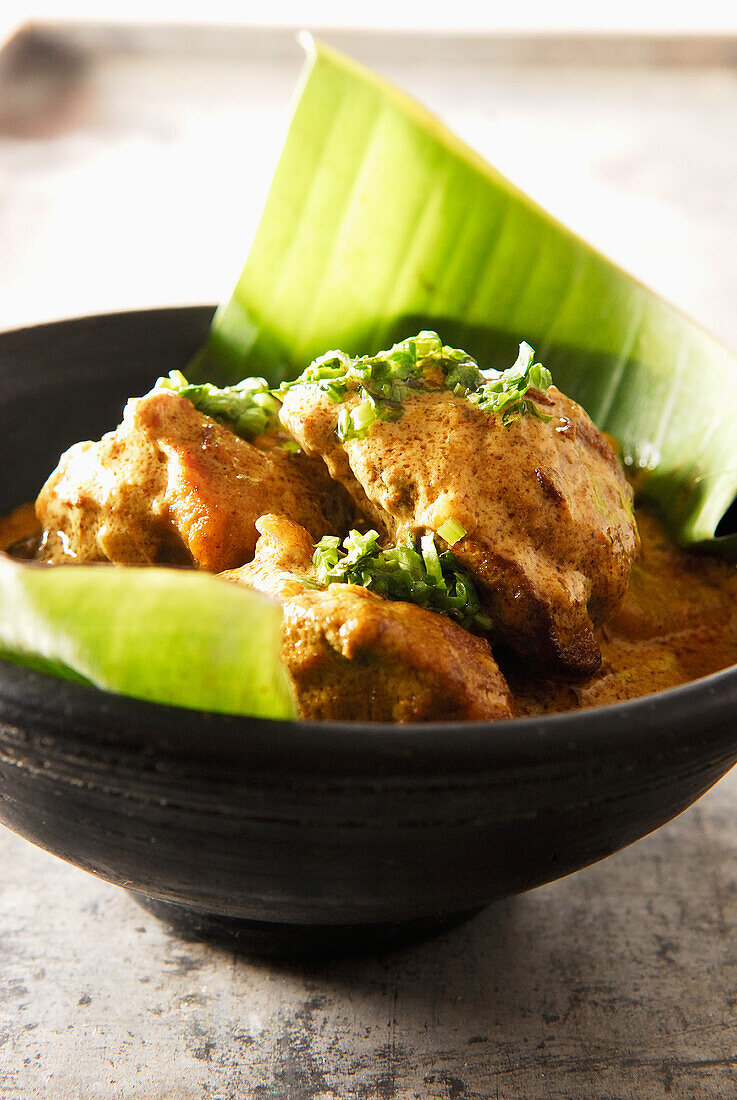 Lamb curry served in a banana leaf