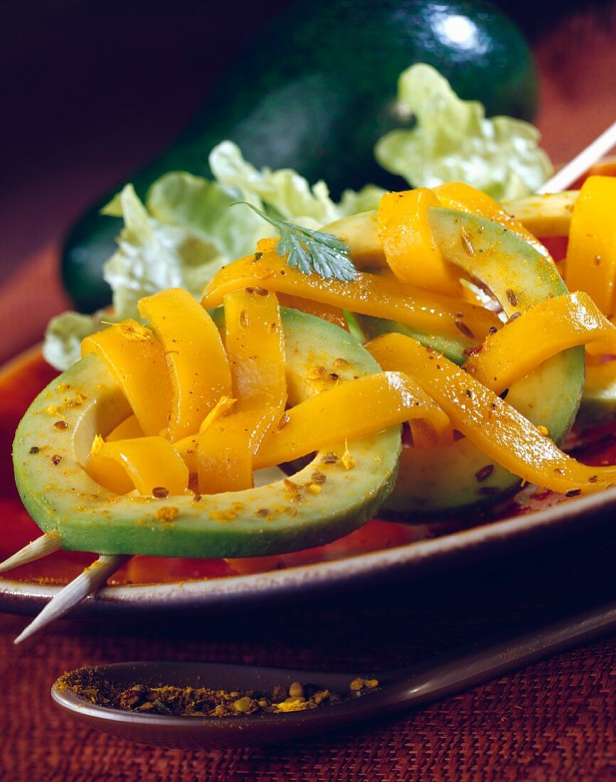 Avocado Carpaccio with thin strips of mango