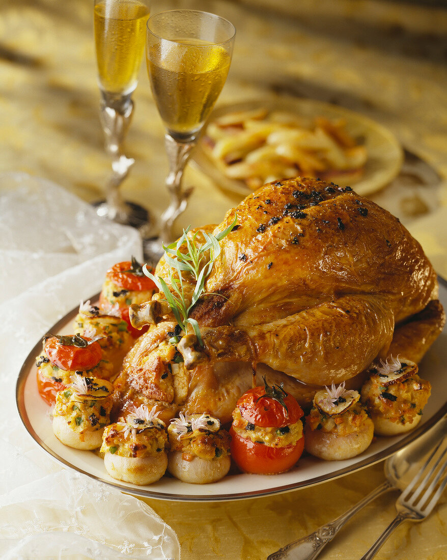 Roasted capon with truffles,tomatoes and stuffed onions