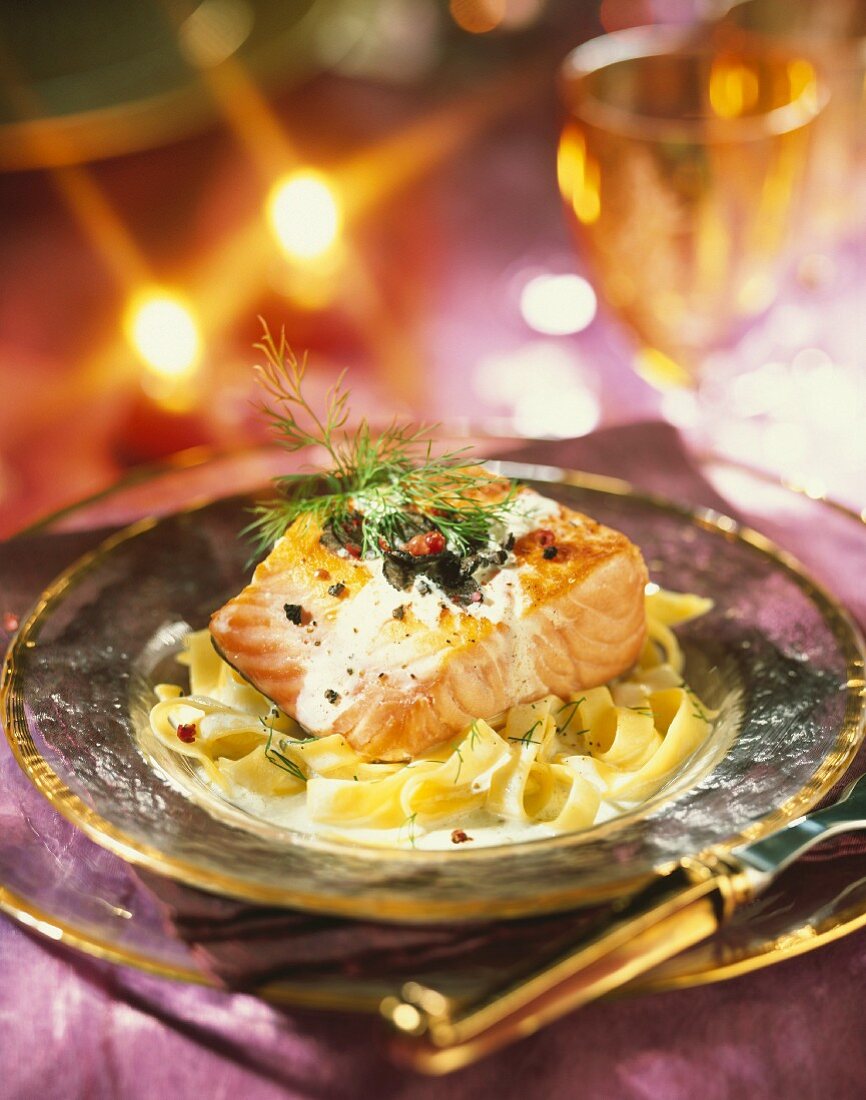 Thick piece of salmon with truffles and creamy tagliatelles