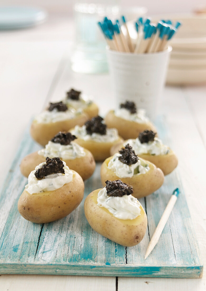 New potatoes filled with tzatziki and tapenade