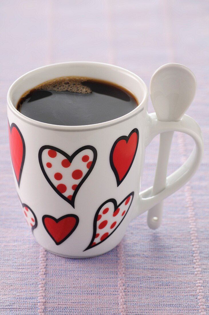 Cup of coffee decorated with hearts