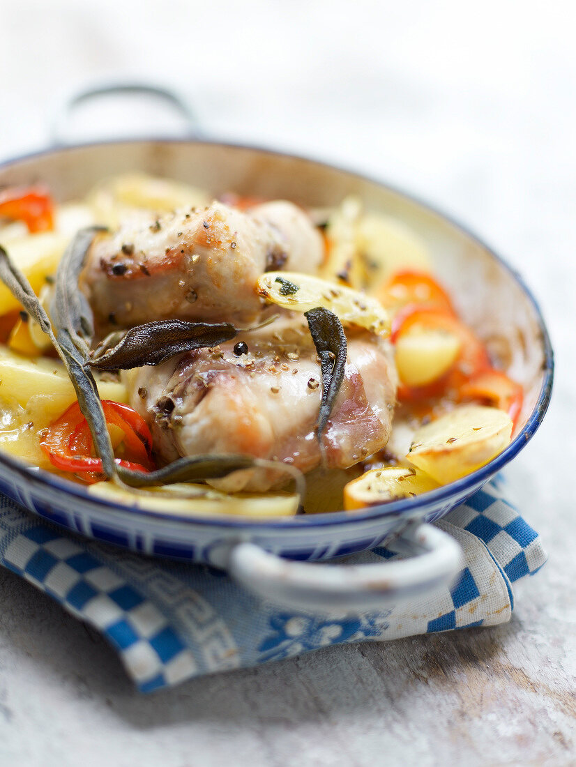 Rabbit saddle with sage,potatoes and tomatoes