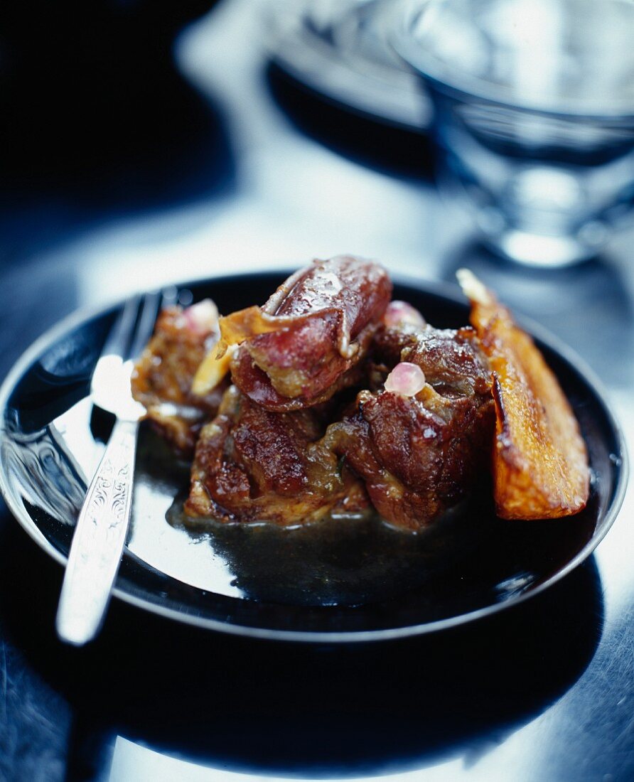 Lamb confit with dates and pomegranate seeds