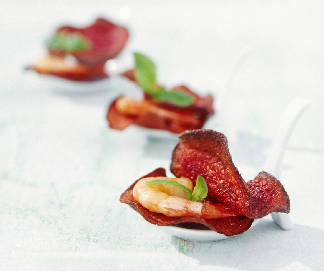 Beetroot chips with shrimp and basil