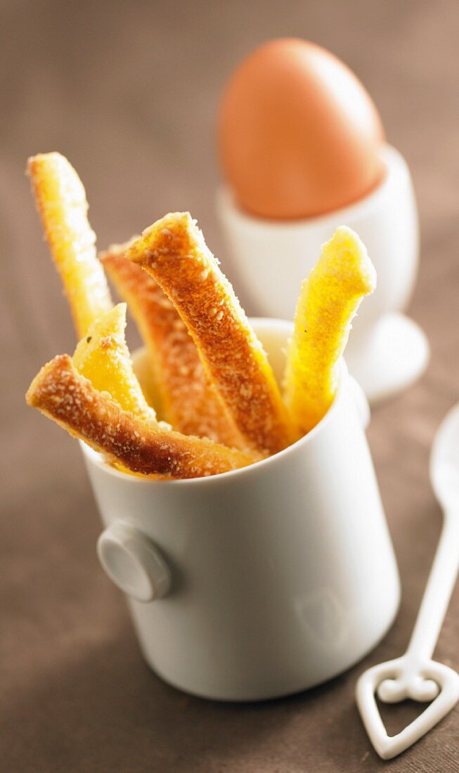 Bread sticks and a soft-boiled egg