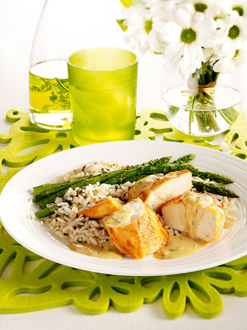 Chicken in cream sauce with rice and asparagus