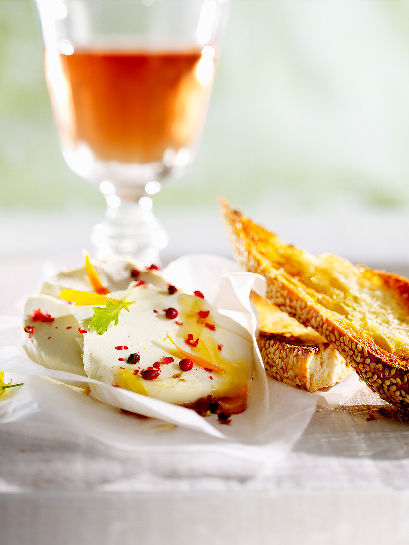 Small goat's cheese with pink peppercorns aand toast