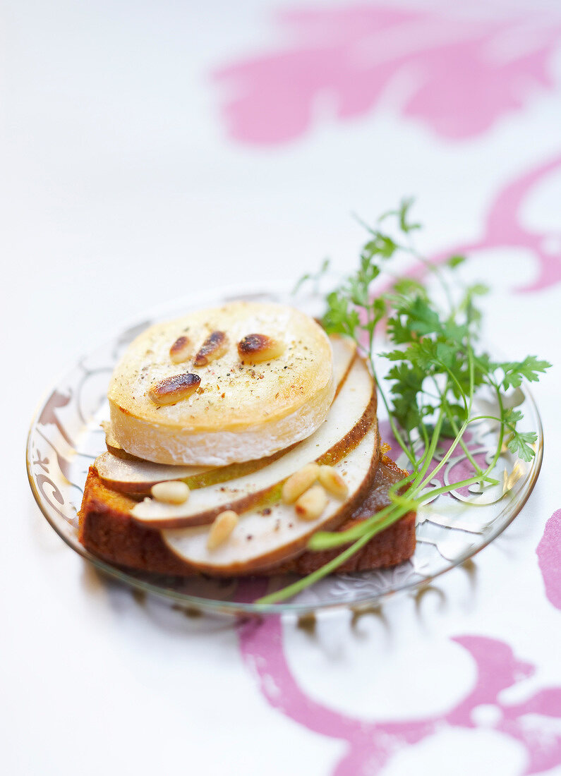 Rocamadour cheese on toast with pine nuts