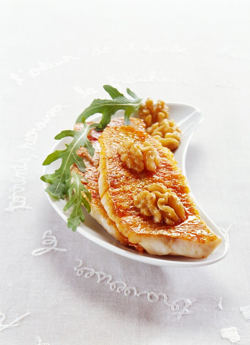 Fried red mullet fillets with walnuts and curry olive oil
