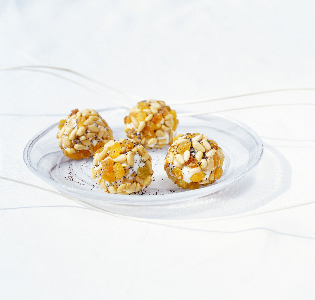 Fresh goat's cheese balls coated with dried fruit