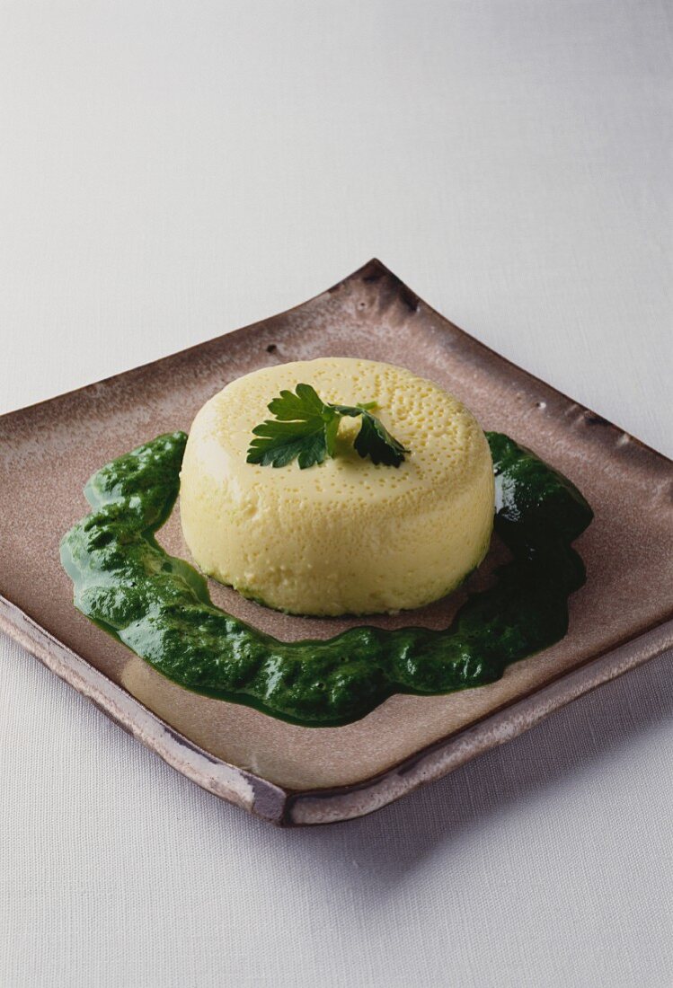 Garlic flan with spinach coulis