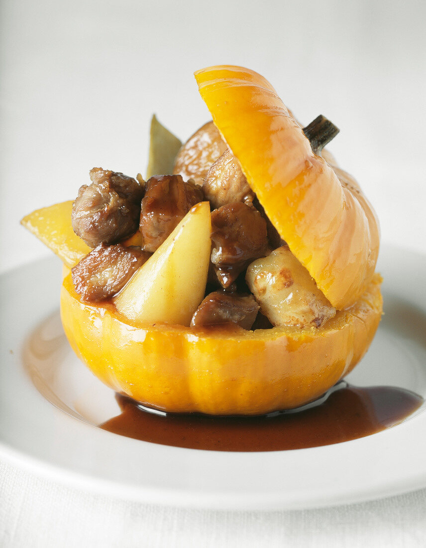 Lamb collar with old-fashioned vegetables served in a small pumpkin