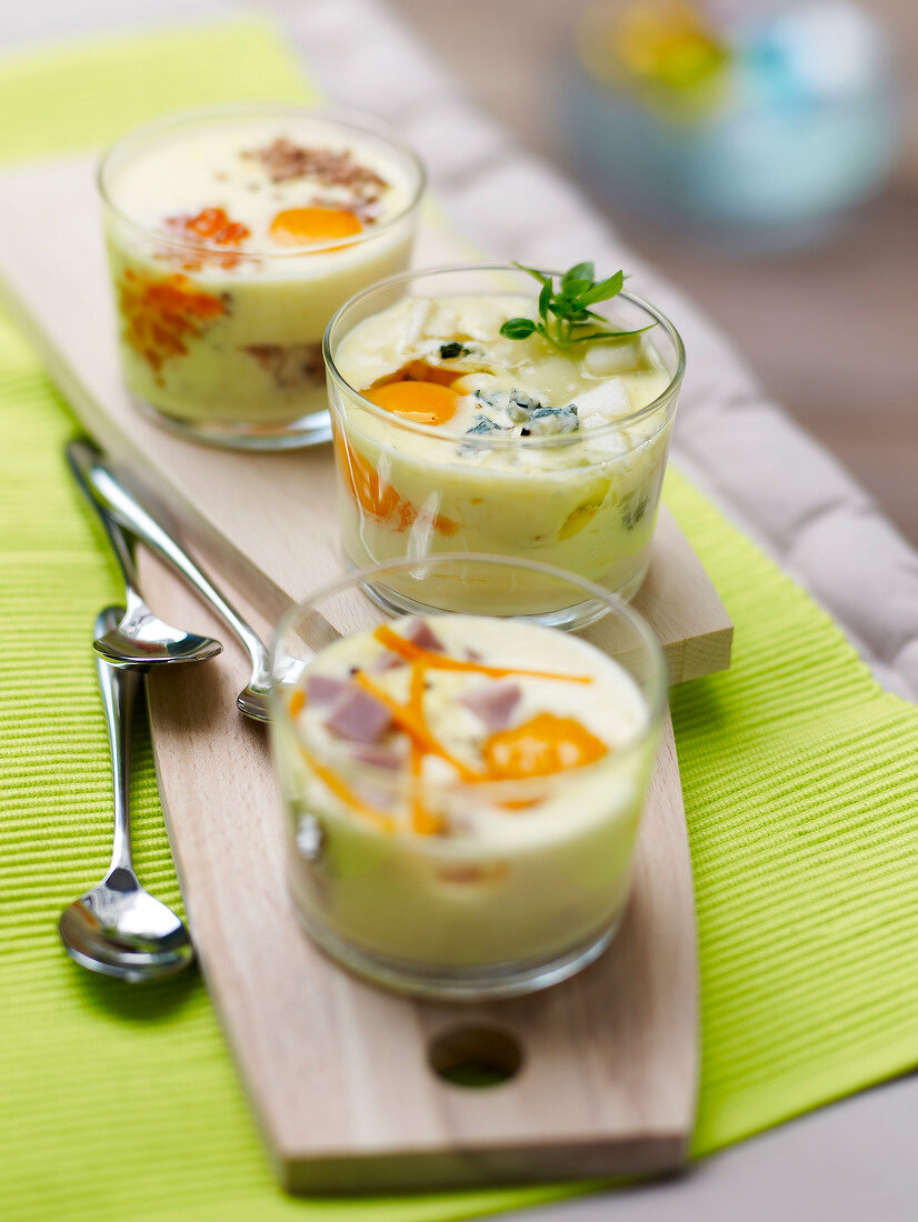 Selection of cheese and ham coddled eggs