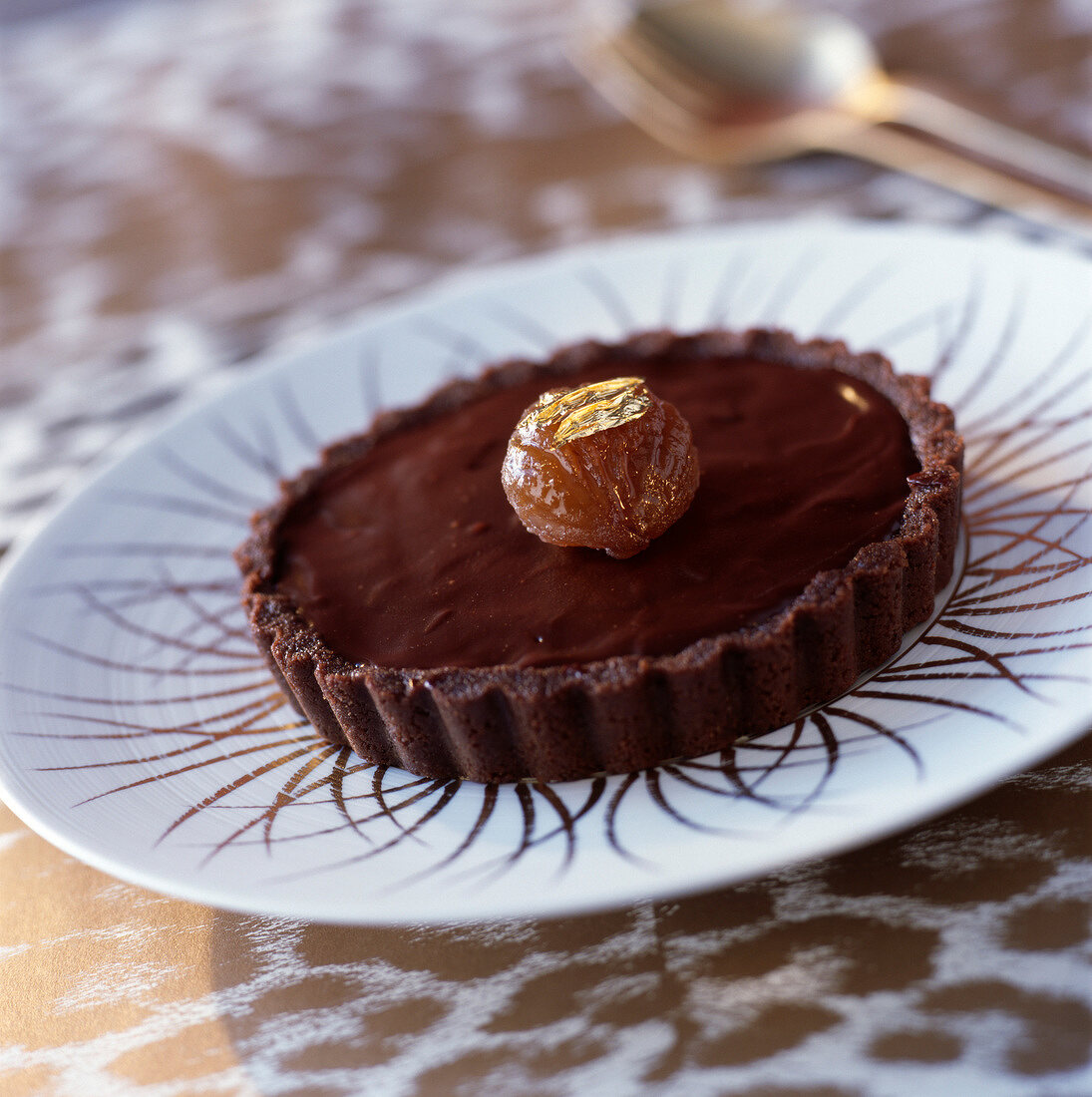 Schokoladen-Kastaniencreme-Rosinen-Törtchen mit Cognac