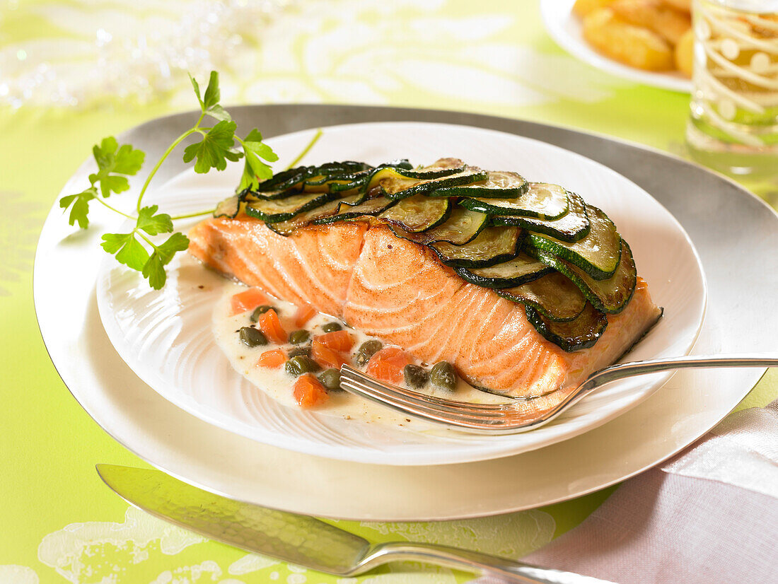 Thick piece of salmon covered with zucchini scales