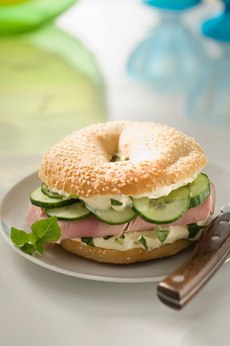 Boiled ham and cucumber bagel sandwich