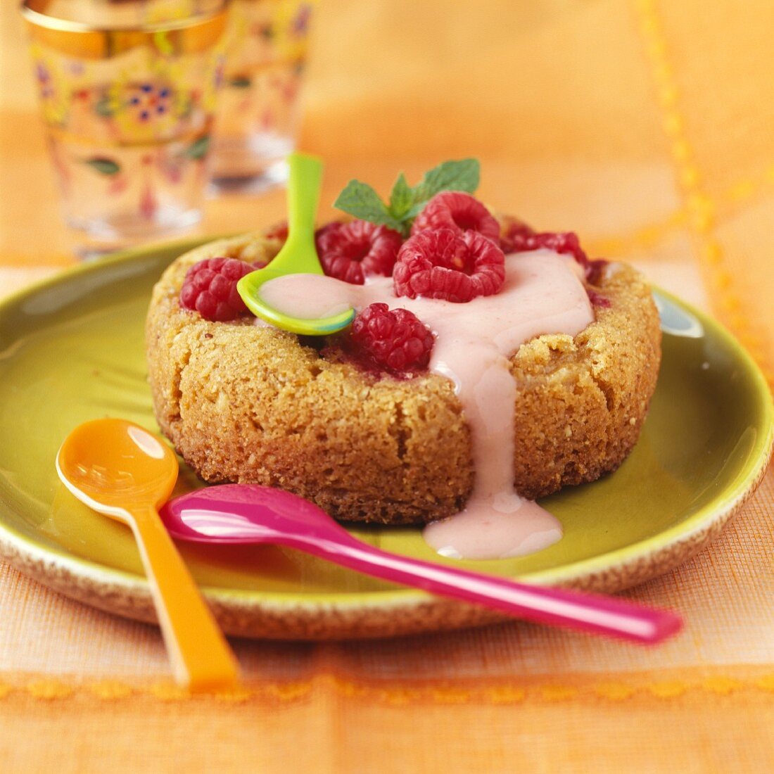 Individual moist almond-flavored cake with raspberry filling