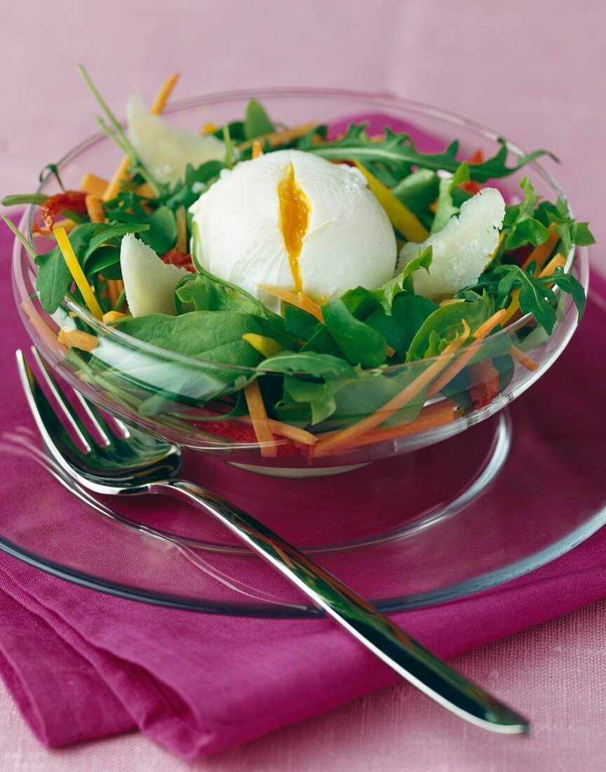 Paoched egg and thiny sliced vegetable salad