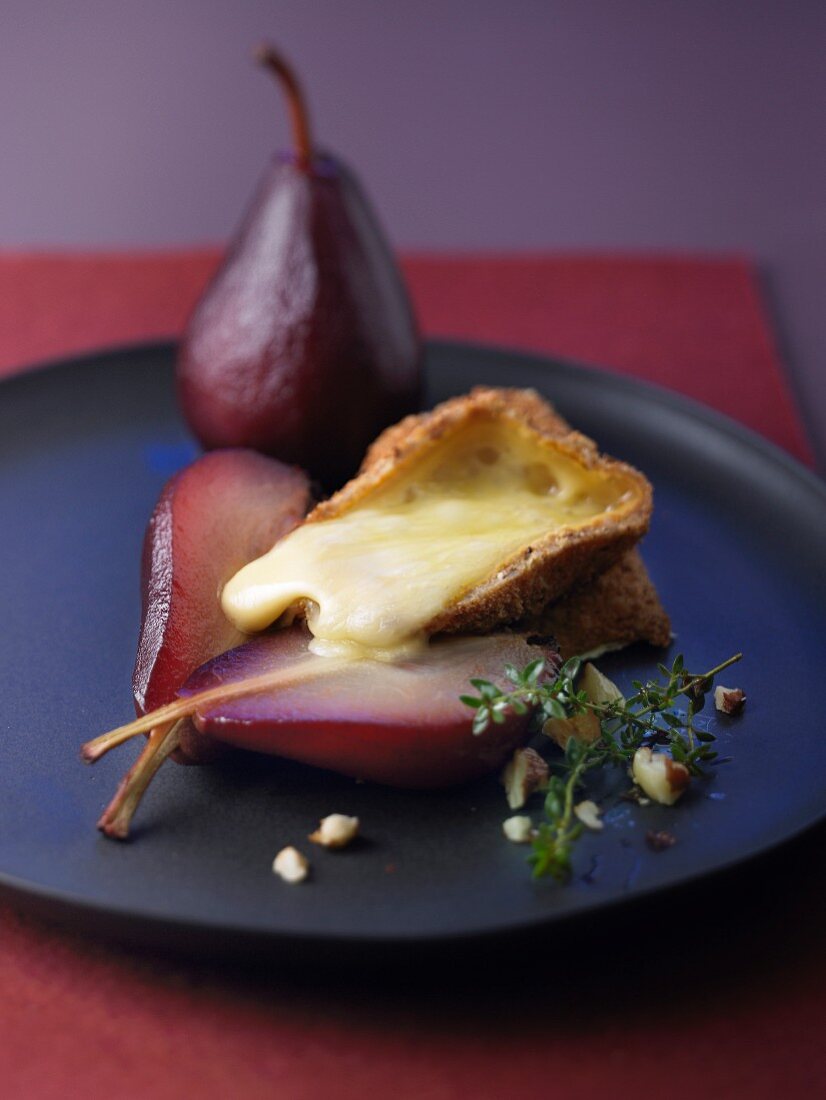 Crisp breaded Livarot with hazelnuts and pears poached in red wine